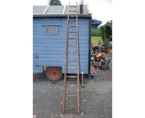 A 15 rung wooden ladder.