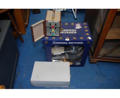 Approximately ten cylinders of photographic slides, projector etc.