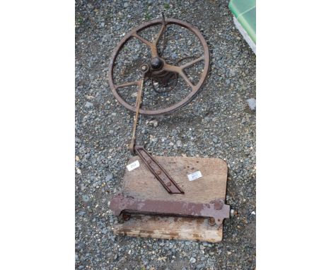 A metal wheel and bracket.