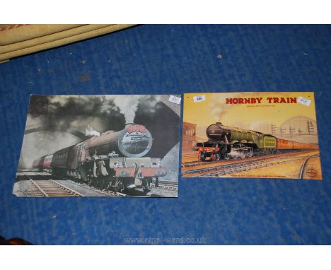 A tin plate Hornby train sign and a print of a train on card.