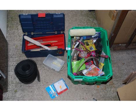A tool box of wire brushes, hand tools, a paint roller, etc.,