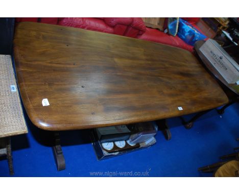 An Ercol dining table, 72" long x 32" wide x 28" high.