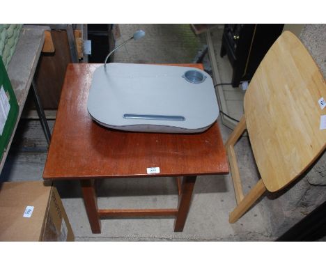 A small table and a lap tray with light.