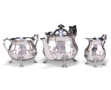 AN EDWARDIAN SILVER THREE-PIECE TEA SERVICE,&nbsp;by George Howson, Sheffield 1904 and 1907,&nbsp;each piece with scalloped f