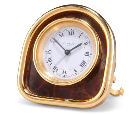 A CARTIER YELLOW-METAL STRUT CLOCK, the arch-top case housing a circular white dial, signed 'Cartier Paris', the movement wit