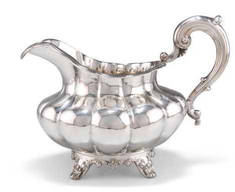 A VICTORIAN SILVER CREAM JUG, by Joseph &amp; Albert Savory, London 1851, squat lobed form with reeded rim, the scroll handle