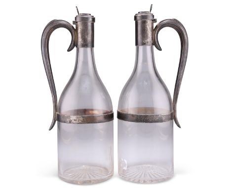 A PAIR OF VICTORIAN SILVER-MOUNTED DECANTERS,&nbsp;by&nbsp;Horace Woodward &amp; Co Ltd, London 1897, bottle-shaped, each wit