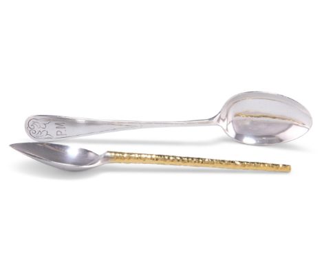 A GEORGE V SILVER SPOON, by Liberty &amp; Co Ltd, Birmingham 1916, the handle terminal engraved to the front with "wings" and