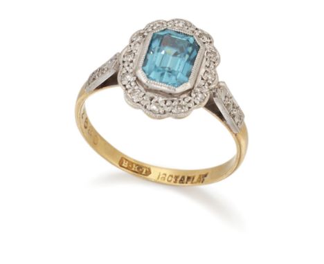 A BLUE ZIRCON AND DIAMOND CLUSTER RING,&nbsp;an octagonal-cut blue zircon within a milgrain border of eight-cut diamonds, to 