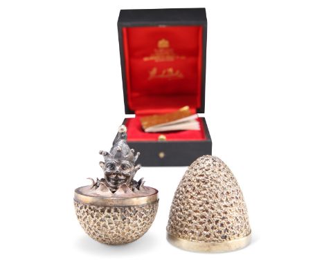 AN ELIZABETH II SILVER-GILT LIMITED EDITION SURPRISE EGG, by Stuart Devlin, London 1979, no. 223, the textured body opening t
