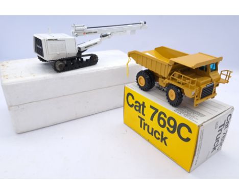 NZG a boxed mixed scale truck and plant pair, to include; 222 - Cat 769C Truck, 213 - Ingersoll Rand ECM450 Track Drill. Cond