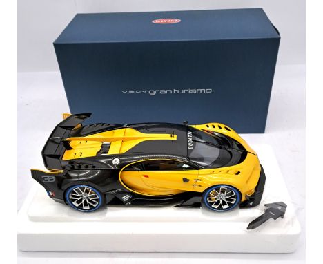 Autoart, a boxed 1:18 scale 70989 Bugatti  Vision Gran Turismo in Yellow and Black Carbon complete with accessory. Condition 