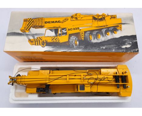 Conrad a boxed 1:50 scale DEMAG AC335 All-Terrain Crane. Conditions appears generally Excellent within generally Fair to Good