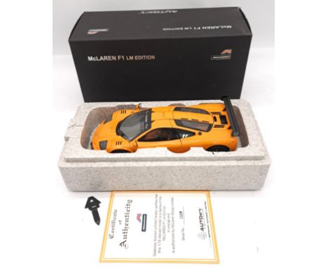 Autoart (Signature Series), a boxed 1:18 scale 76011 McLaren F1 LM Edition in orange and Black detailing. Comes complete with