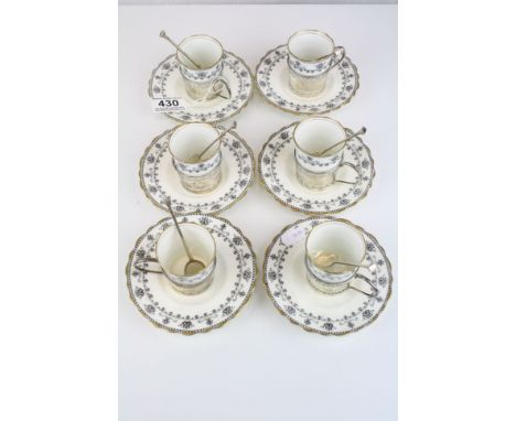 Set of Six Aynsley Coffee Cans and Saucers, the cans held in Pierced Silver Hallmarked Holders with Six matching Silver Coffe