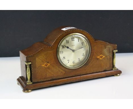 Early 20th century eight day mantle clock with inlaid decoration and brass mounts