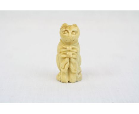 19th century Ivory Carving / Netsuke of a Seated Cat wearing a Bow, 4.1cms high