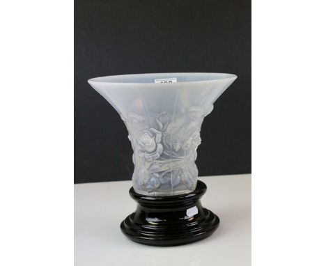 20th century opaque trumpet shaped vase with rose flower decoration in the style of Lalique on a black ceramic stand