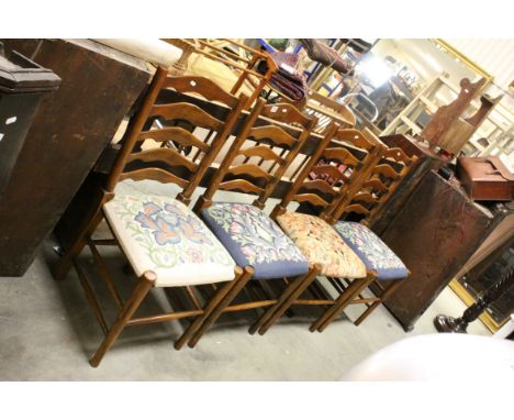 Four Oak Ladder Back Chairs, each with a different stuff-over Needlework Seat