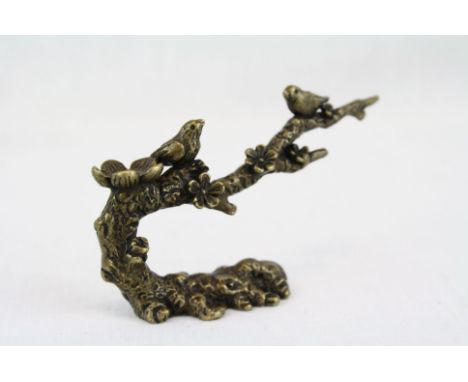 Bronze sculpture of birds on a tree 