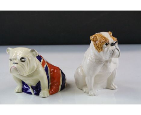 Two Royal Doulton ceramic models of Bulldogs, one with draped Union Jack flag design, tallest approx 12.5cm