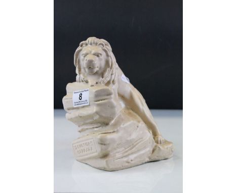 Glazed Stoneware model of a Lion on Rocks and marked "Doultons Carrara" with cream finish, stands approx 20cm, used to promot