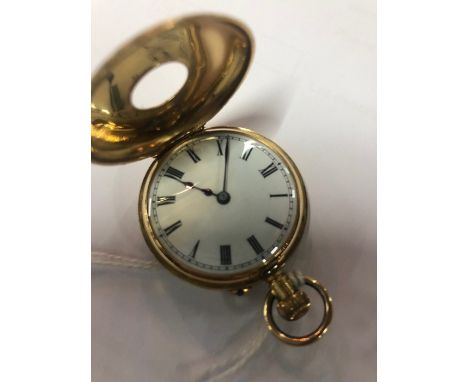 A lady's 18k half-hunter fob watch with pink enamel outer chapter ring and overall floral and scrolling engraving, 18k inner 