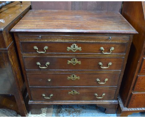 A George III mahogany chest of four long graduated drawers beneath a full width brush slide, on shaped bracket feet.&nbsp; 77