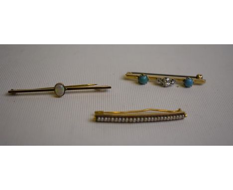 Three various bar brooches - a 9ct yellow gold bar brooch with collet-set oval opal; a 9ct yellow gold bar brooch with caboch