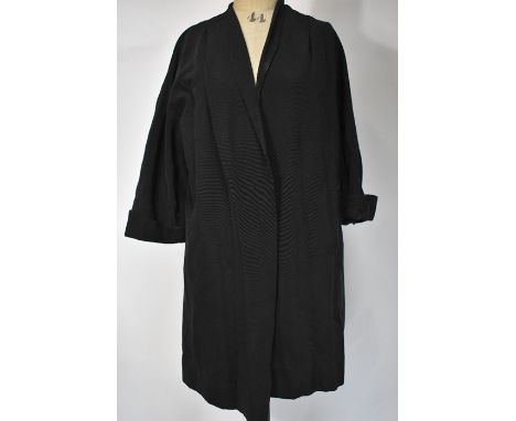 A 1950s ribbed black satin evening coat, a vintage black velvet evening cloak with padded and ruched collar, a black wool gab