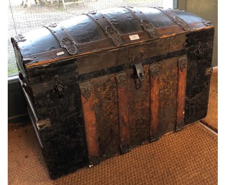 A Victorian oak and metal bound dome topped trunk, 82.5 cm wide (lacking leather side handles)