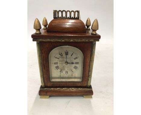 A 19th century brass mounted mahogany carriage clock with two train movement and silvered arched dial, signed Barber &amp; Co