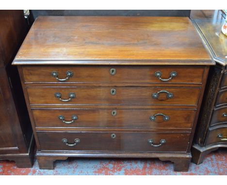 A 19th century mahogany chest of four long graduated cock-beaded drawers, raised on shaped bracket feet, 96 cm w x 53 cm x 80