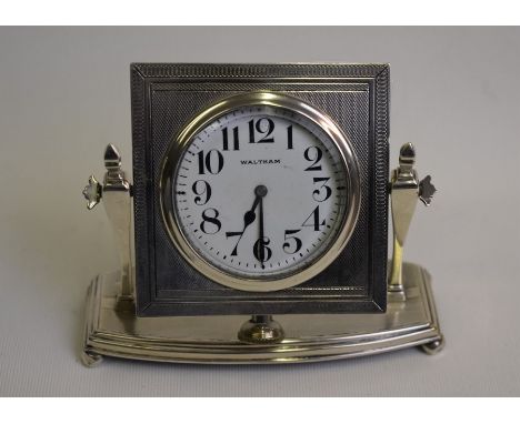 An Art Deco engine-turned silver desk-clock with Waltham movement, swiveling on a platform stand, James Griffiths, Chester 19