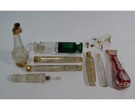 A collection of 19th century and later glass scent flasks and phials, including facetted gilt examples, two-colour double-end