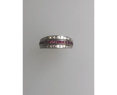 A Victorian night and day swivel ring, with channel set baguette cut diamonds, sapphires and rubies, white metal set, size S,