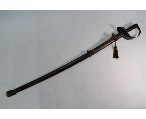 A 19th century cavalryman's sword with 85 cm slightly curved blade and curved sheet-metal basket pierced with quatrefoil, hat