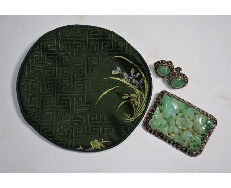 A 19th century Chinese reticulated green jade rectangular brooch, carved with finger citron, peach and plum blossom in a whit