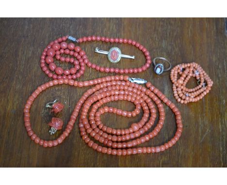 Three antique coral necklaces, a pair of carved coral rose clip-on earrings, bar brooch and cameo ring