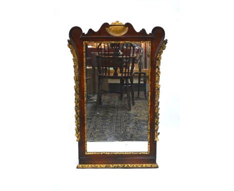 A George IV mahogany and giltwood adorned mirror, 101 x 67 cm with silvered plate