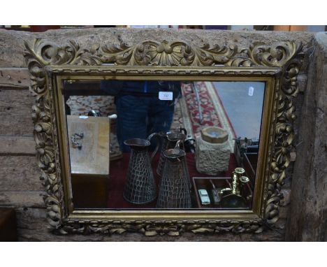 An antique giltwood framed wall mirror, 63 cm x 72 cm&nbsp;
