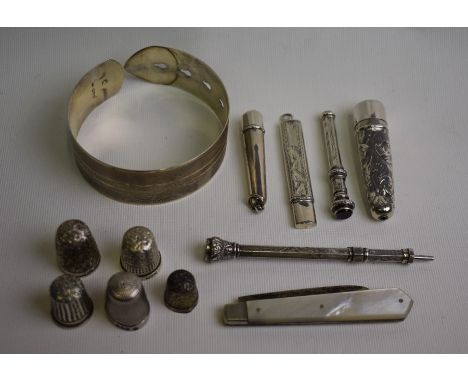 An adjustable silver bangle in the form of a belt with engine turned decoration, Charles Horner, Chester 1945, to/w five vari