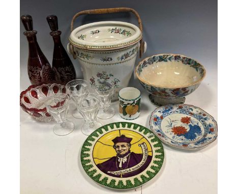 A pair of ruby overlay glass decanters and stoppers, a set of four early 20th century moulded glass rummers, a Wemyss preserv