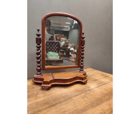 A Victorian mahogany firescreen with tapestry panel, 116cm high, together with a Victorian toilet mirror