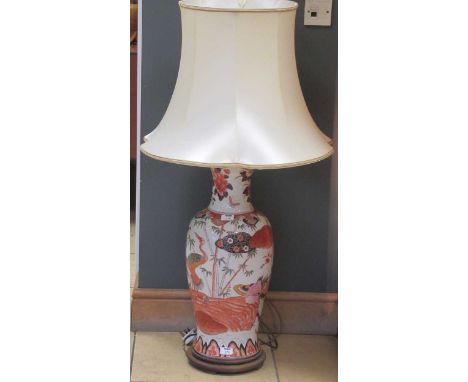 A Chinese style ceramic lamp with shade