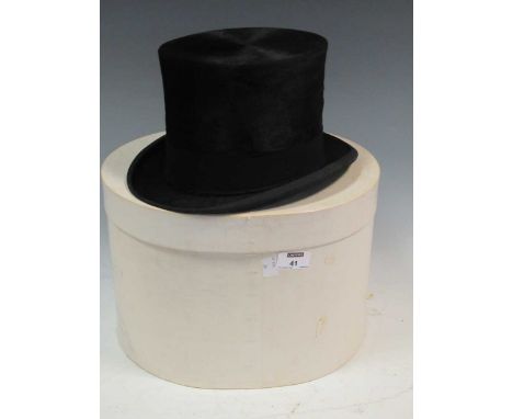 A 'Henry Heath Limited' tophat inscribed on inner lining 'K C D', black silk with a black band and leather sweatband, interal