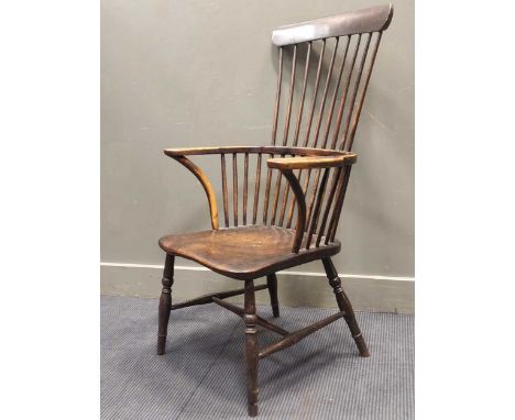 A comb back windsor elbow chair 112 x 60 x 46cmCondition report: Top rail of the chair heavily knocked to the top,Seat has hi