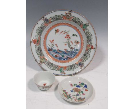 A Chinese Kangxi 'eight immortals' plate, a teabowl &amp; saucer c1730-40 (2)Condition report: Rubbing and wear to the gilt a