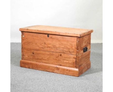 An antique pine trunk, with a hinged lid80w 42d x 50h cm