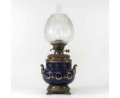 A 19th century brass mounted blue glazed pottery oil lamp, with an etched glass shade, 51cm high overallOverall dirty and, wi